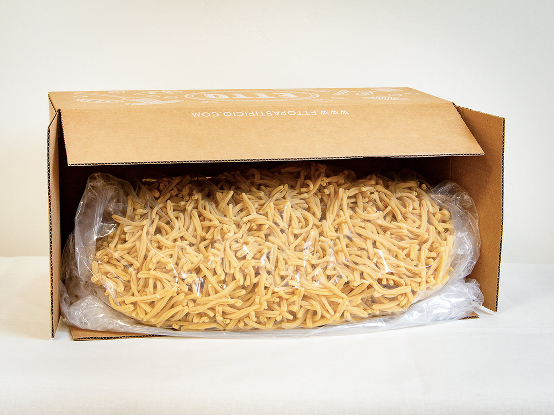 Box of dried pasta on a white background