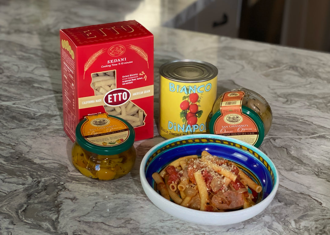 sedani pasta box, can of tomatoes, jar of roasted onion, jar of roasted peppers, bowl of pasta